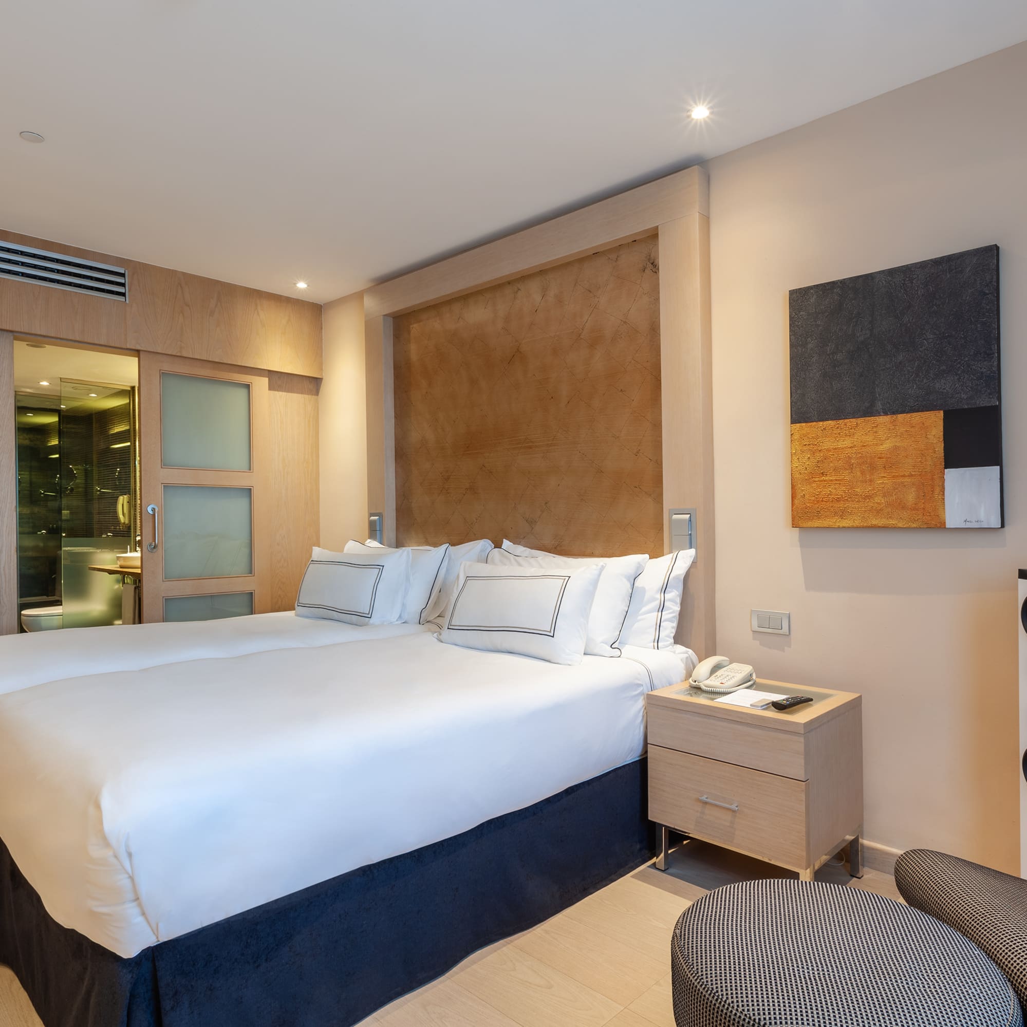 a room with a bed and a chair