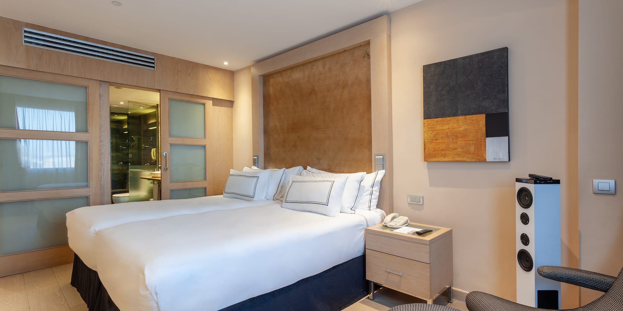 a room with a bed and a chair