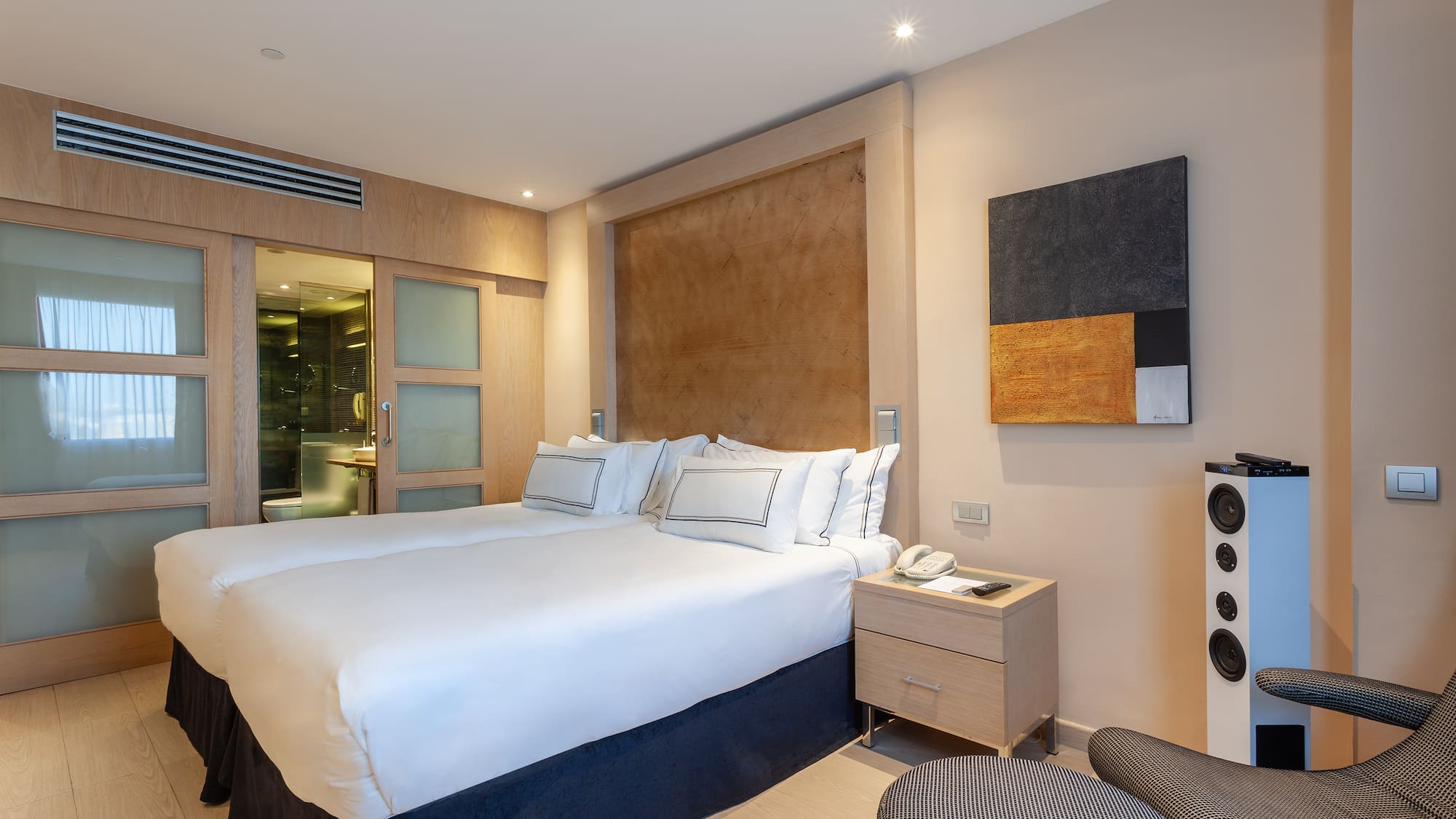 a room with a bed and a chair