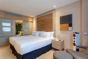 a room with a bed and a chair
