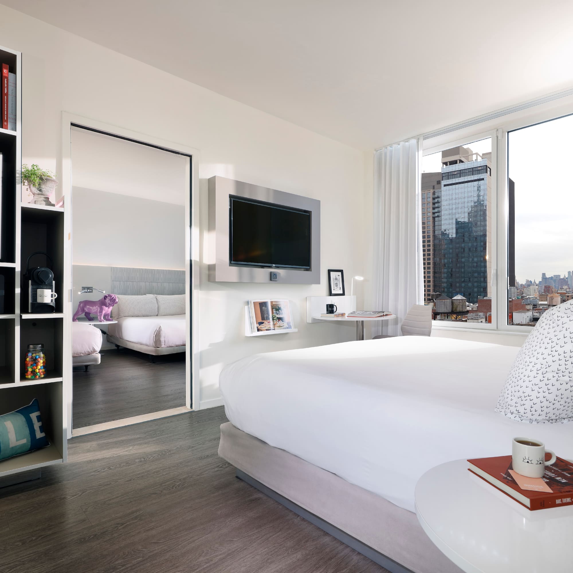 a bedroom with a large bed and a large mirror