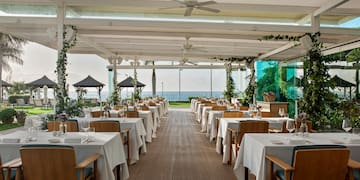 a restaurant with tables and chairs