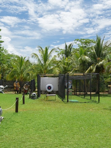 a playground with a gun and a gun in the middle of a field