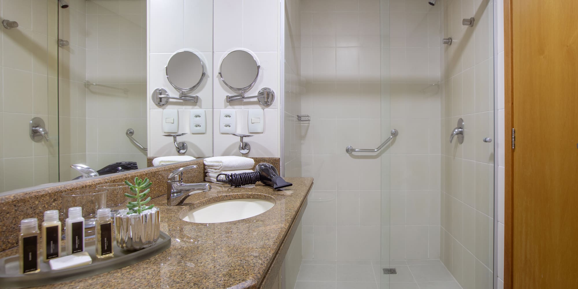 a bathroom with a shower and sink