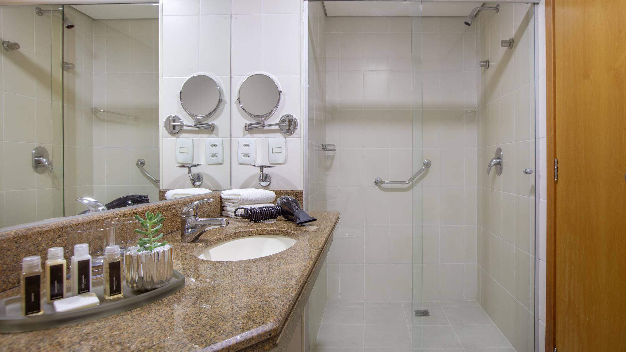 a bathroom with a shower and sink