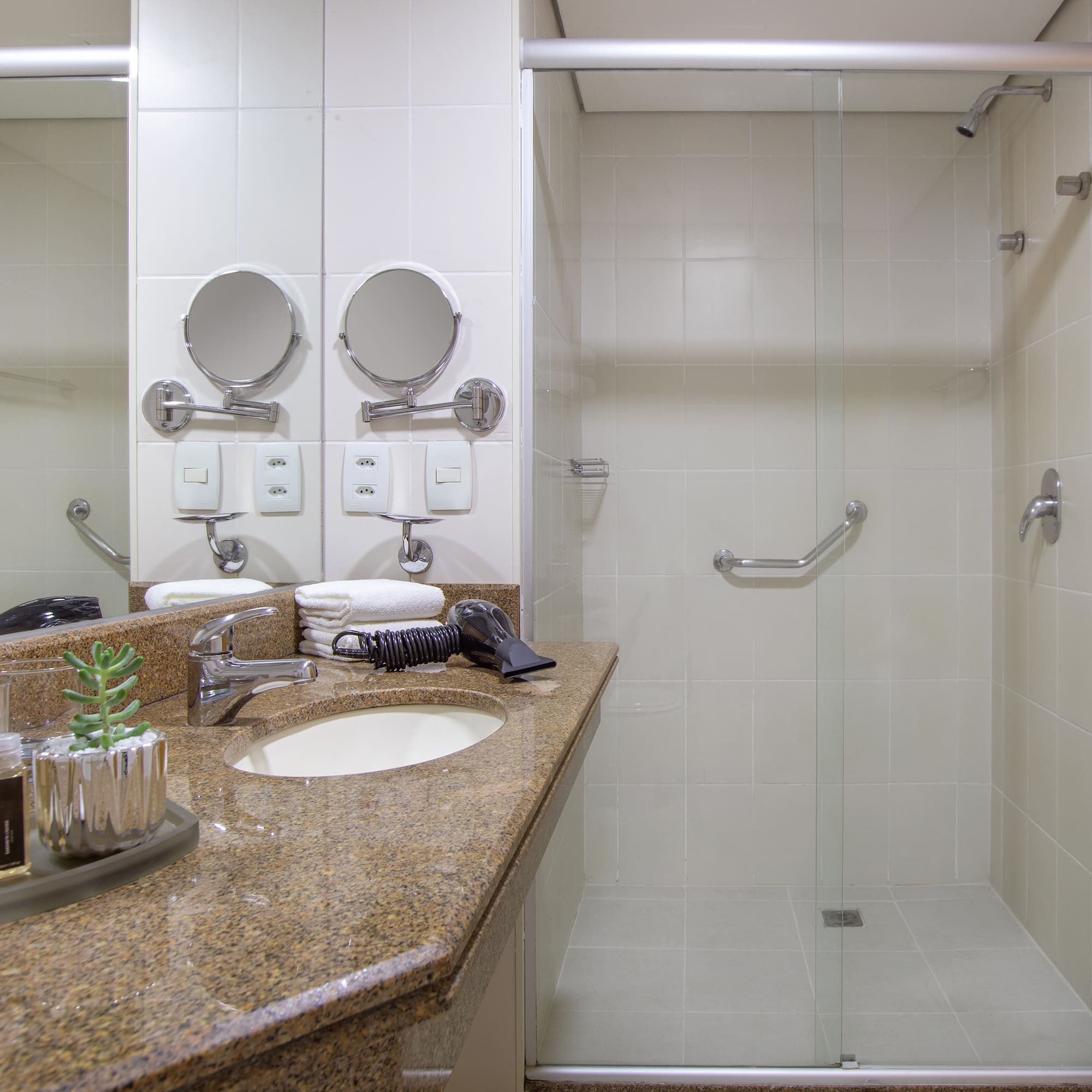 a bathroom with a shower and sink