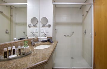 a bathroom with a shower and sink