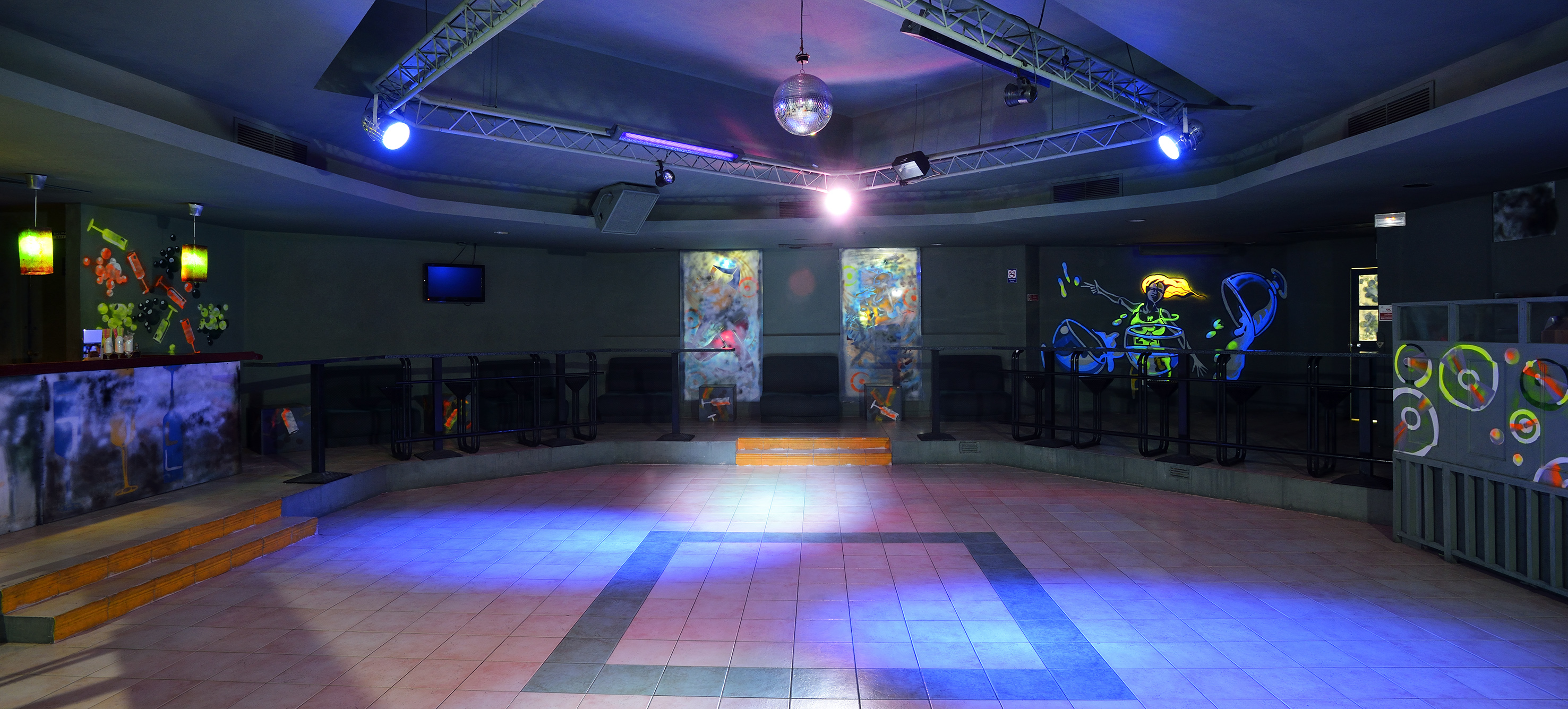 a room with a mirror ball and a mirror on the ceiling