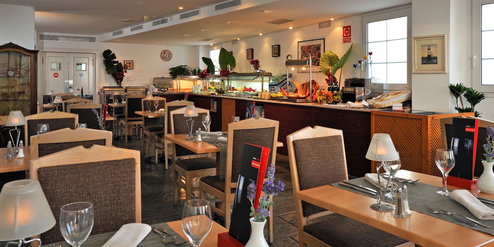 a restaurant with tables and chairs