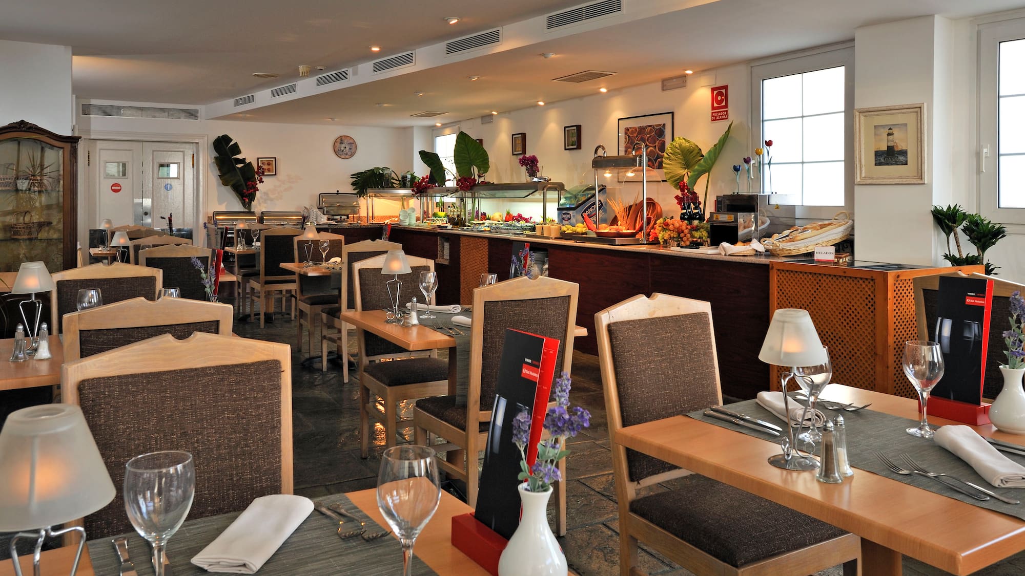 a restaurant with tables and chairs