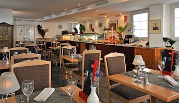 a restaurant with tables and chairs