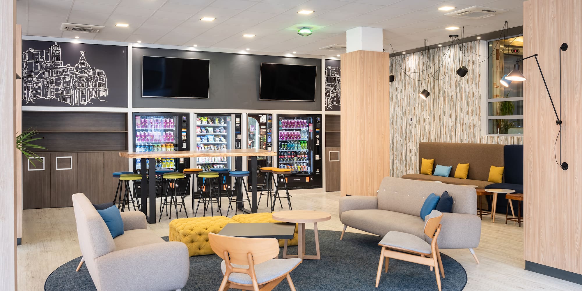 a room with couches and tables and drinks