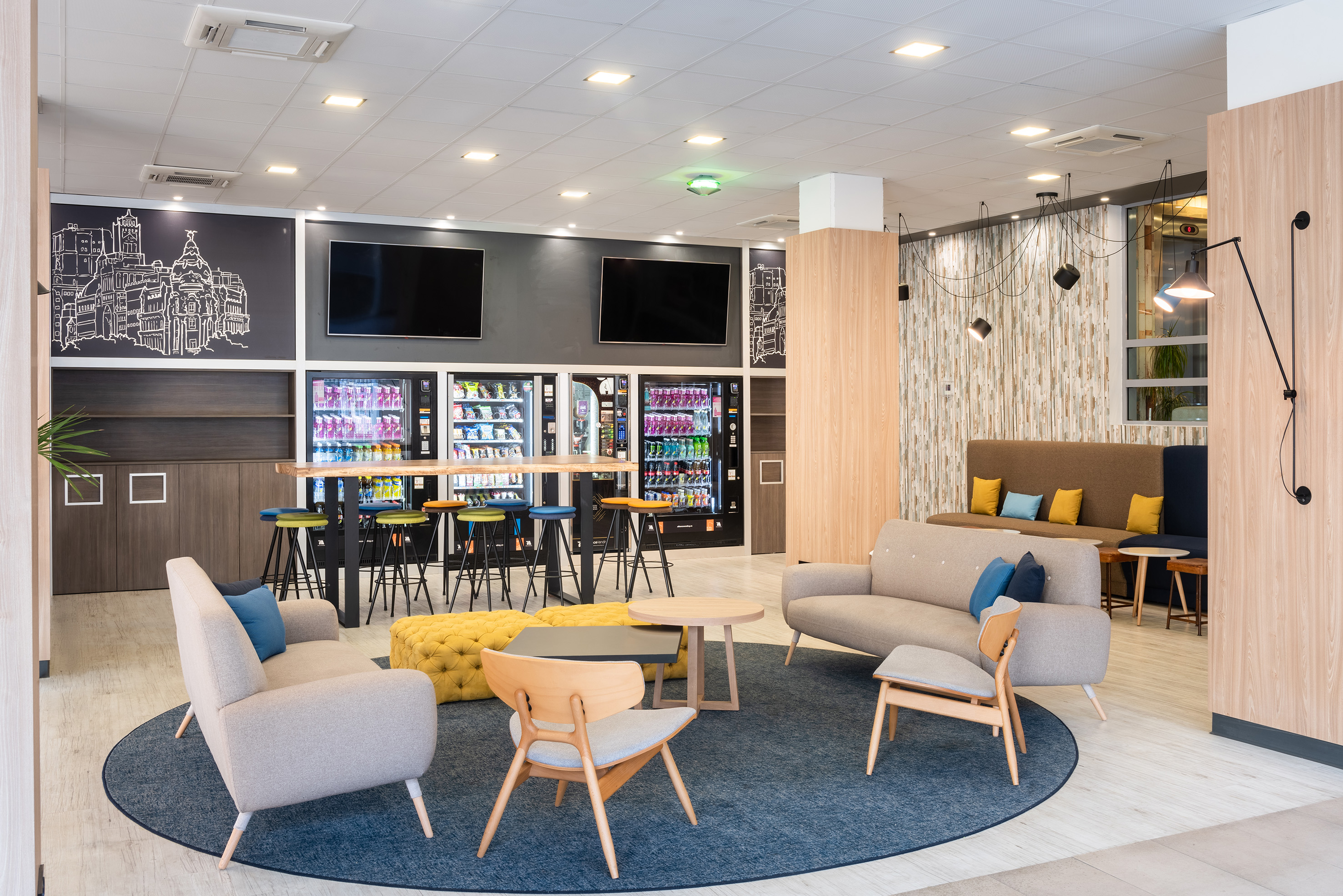 a room with couches and tables and drinks