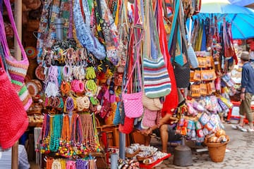 a display of colorful bags and necklaces