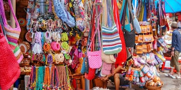 a display of colorful bags and necklaces