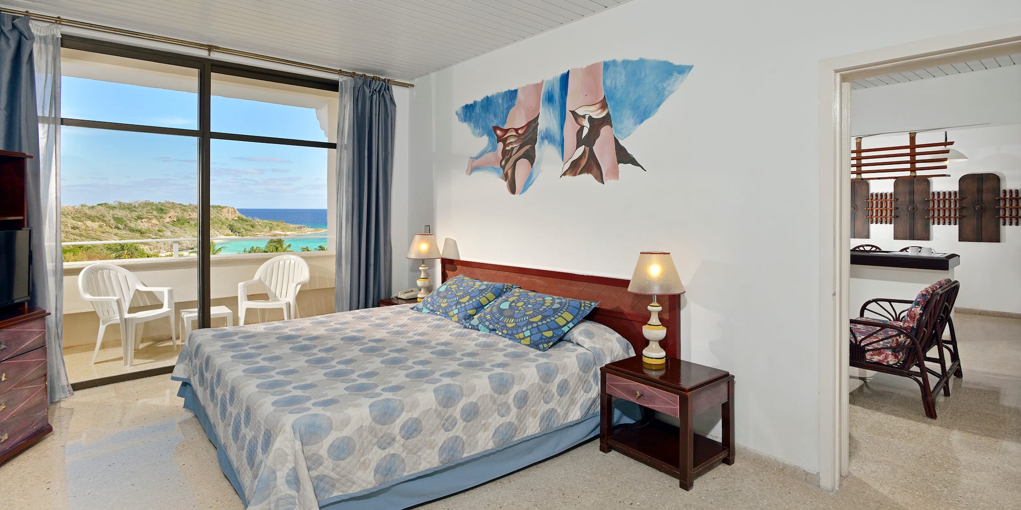 a bedroom with a bed and a table