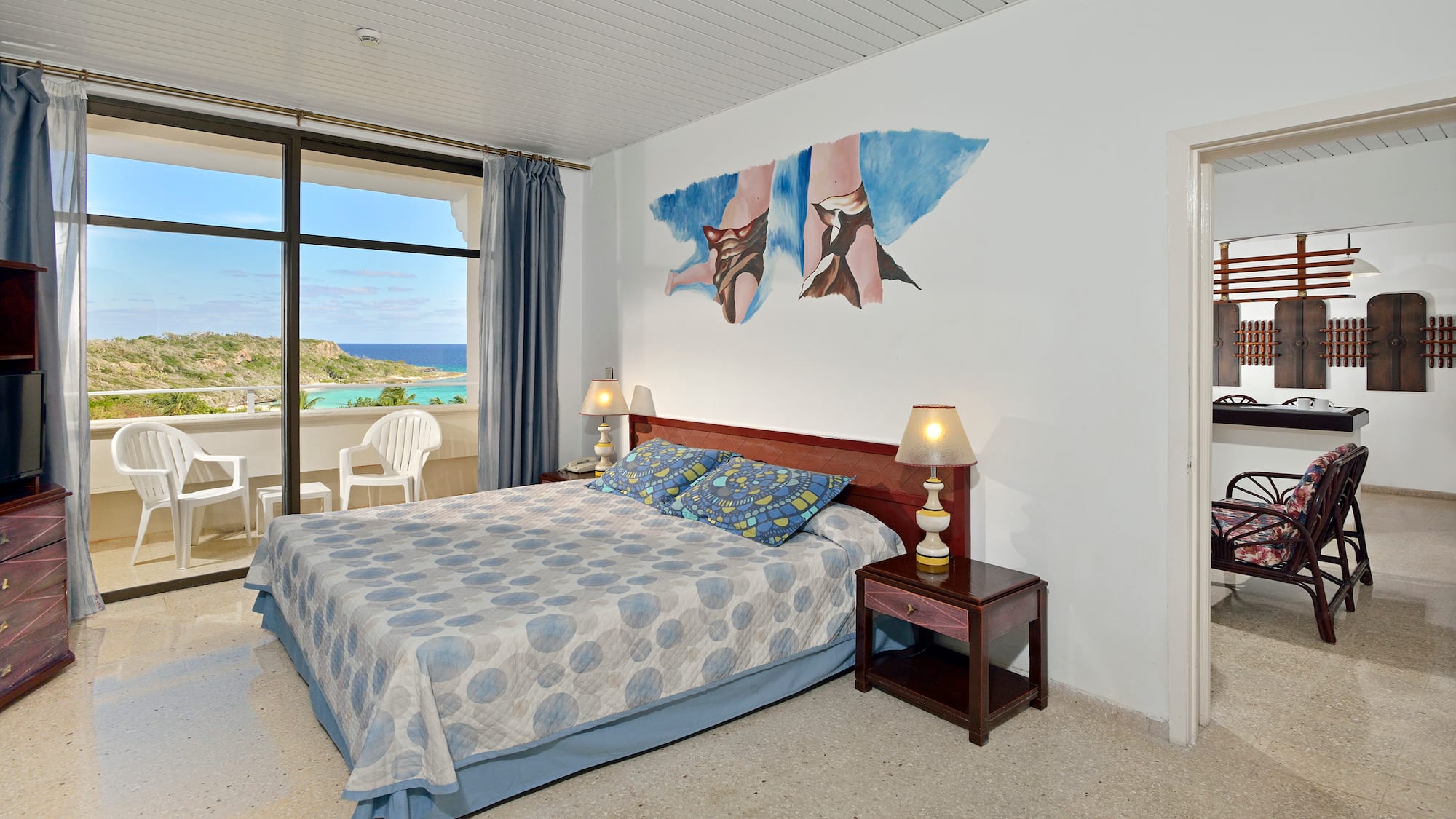 a bedroom with a bed and a table