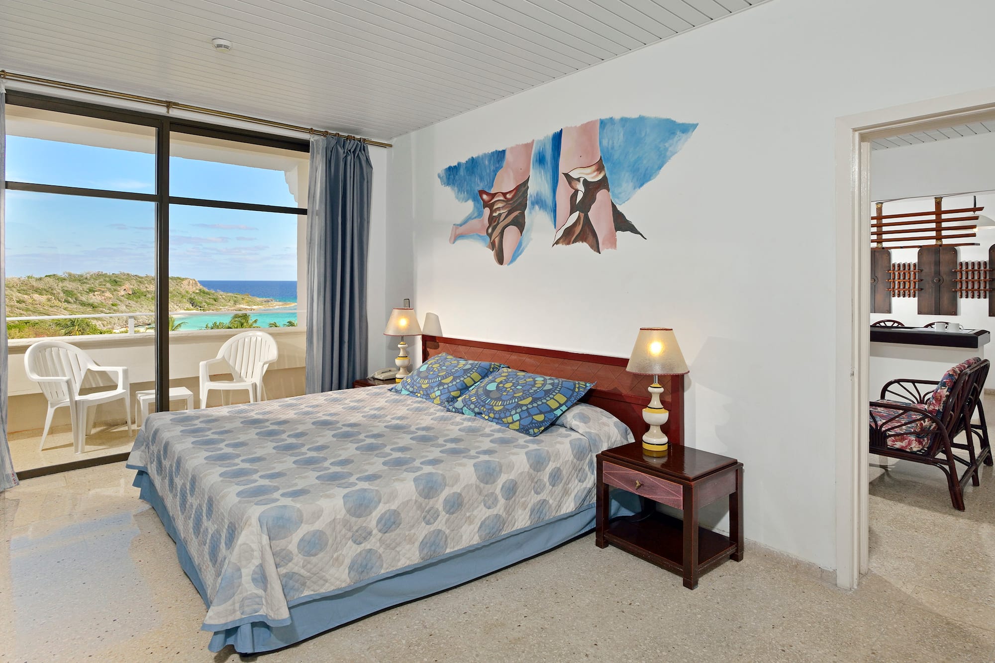 a bedroom with a bed and a table