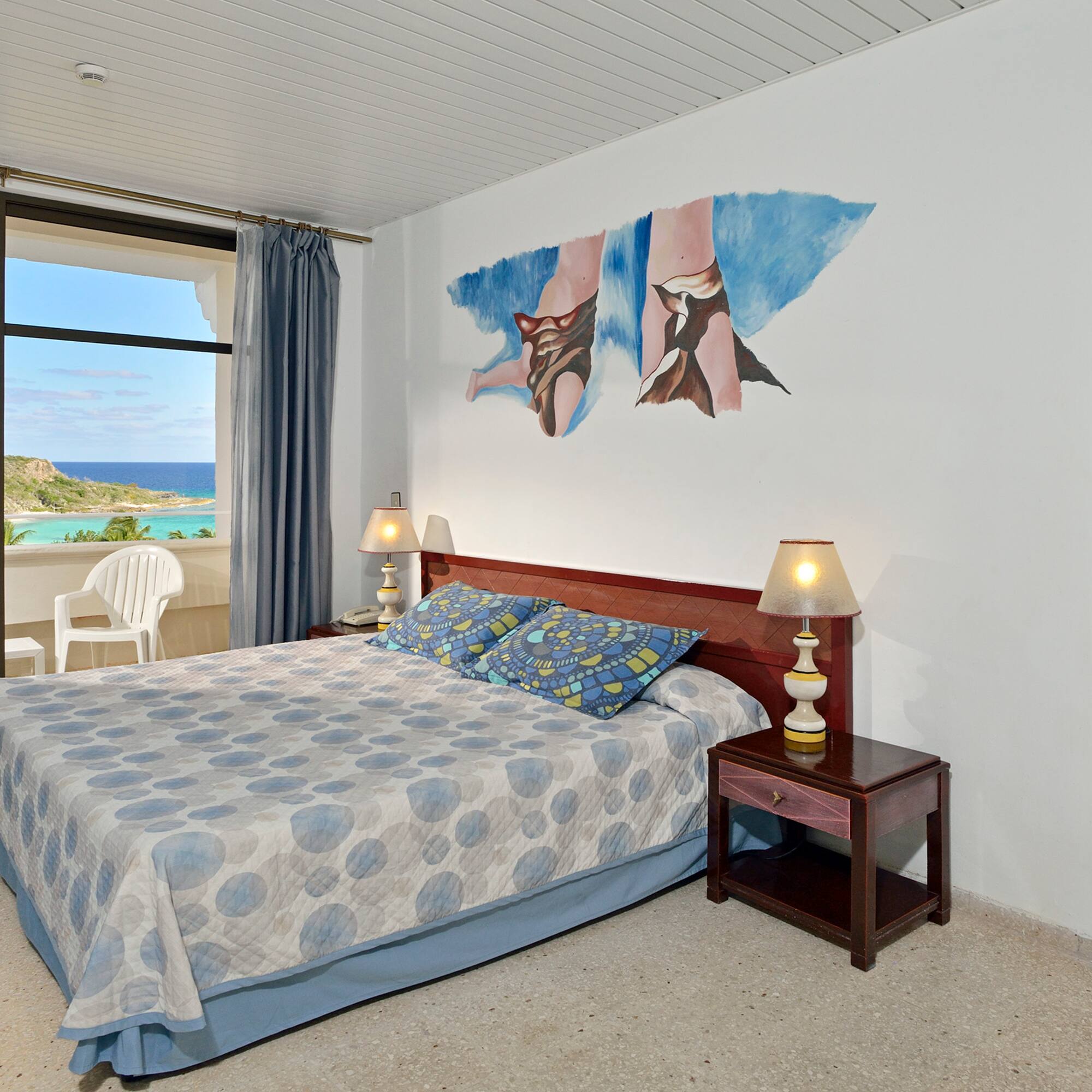 a bedroom with a bed and a table