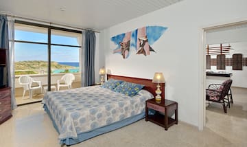 a bedroom with a bed and a table