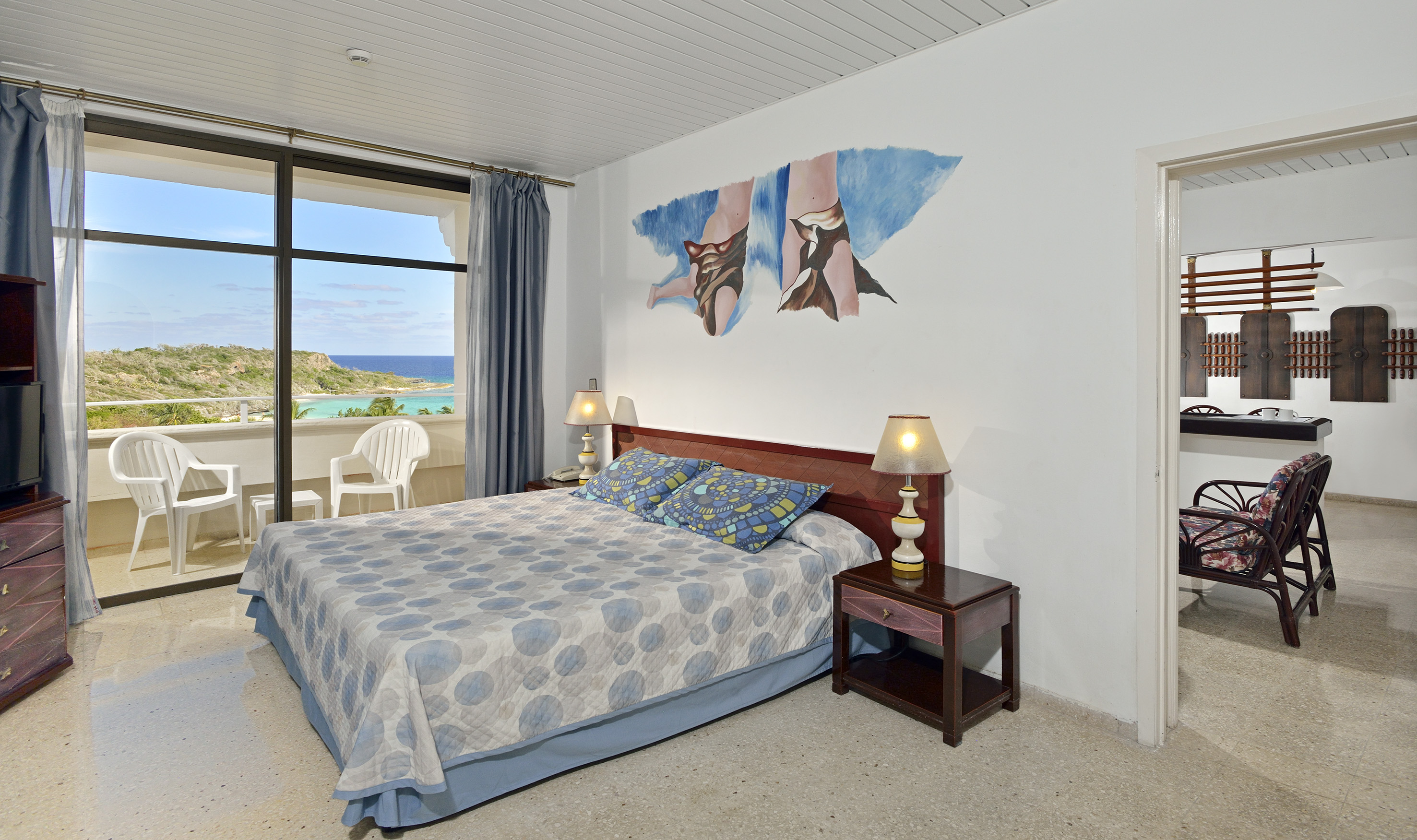 a bedroom with a bed and a table