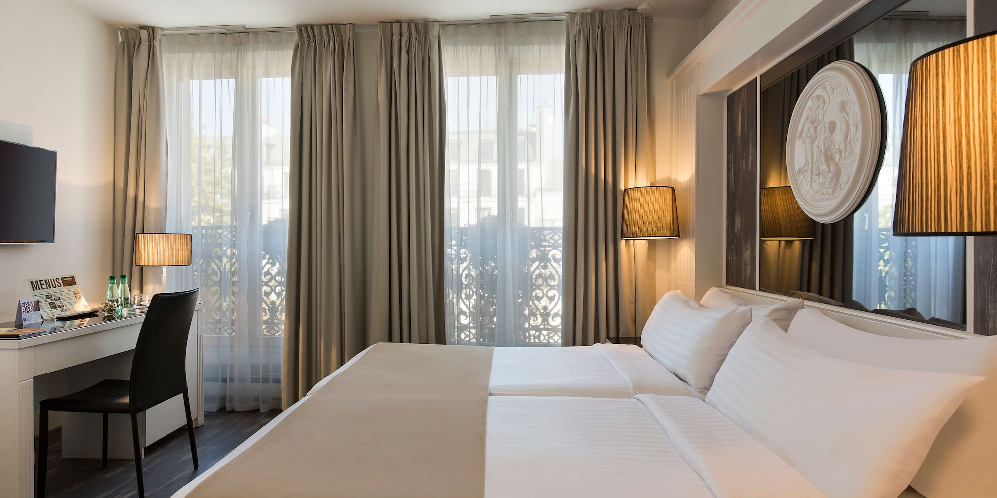 a room with a bed and a desk