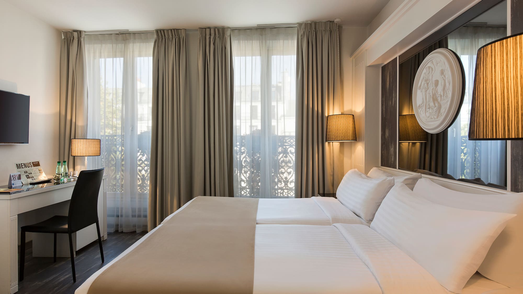 a room with a bed and a desk