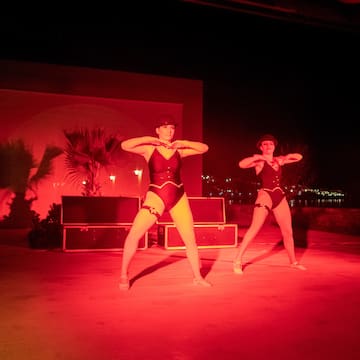 two women dancing on a stage