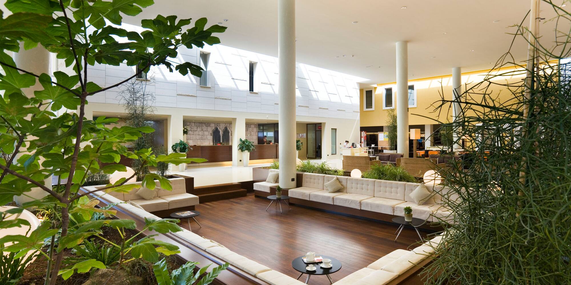 a room with a large white couch and a table