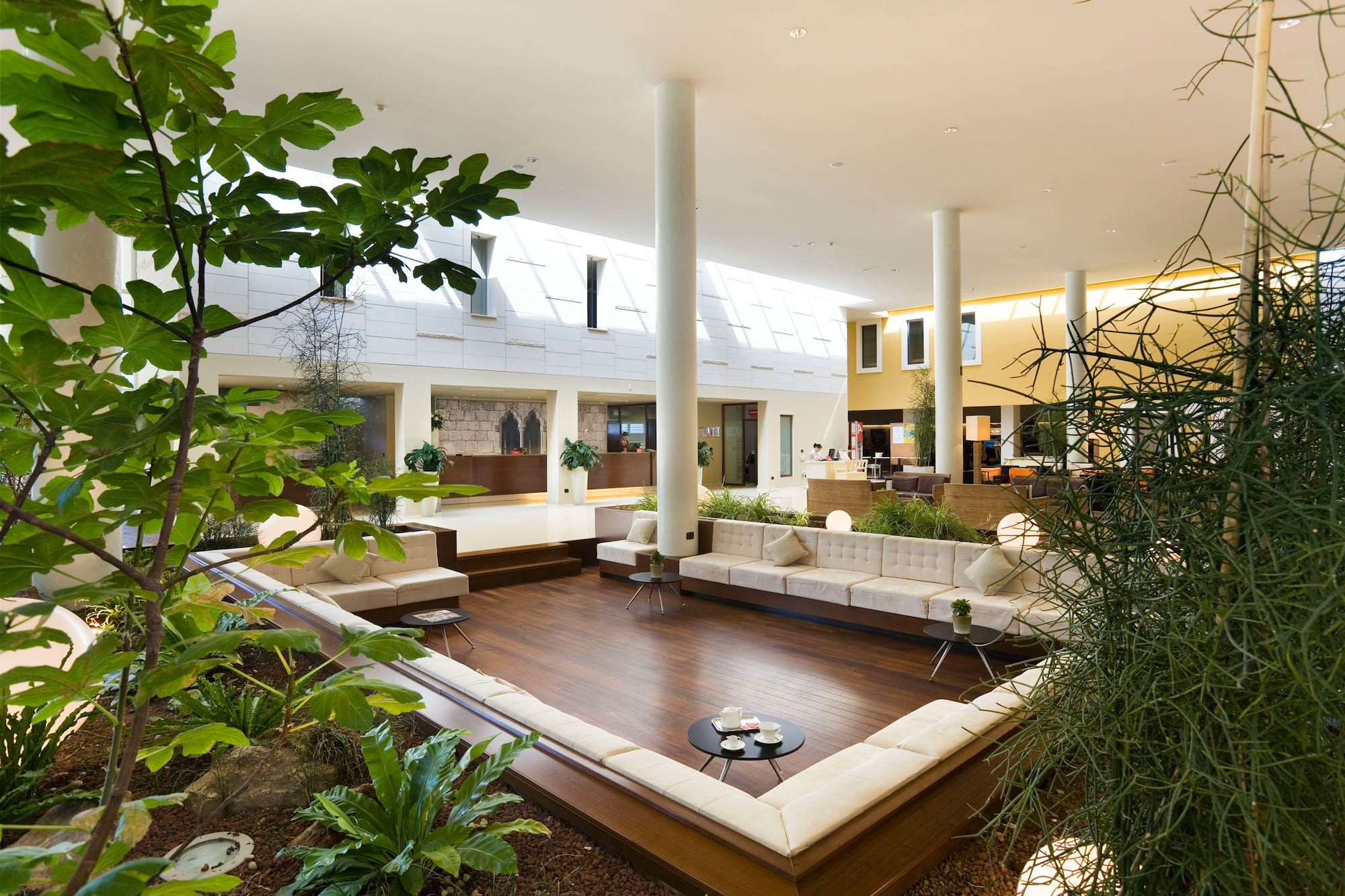 a room with a large white couch and a table