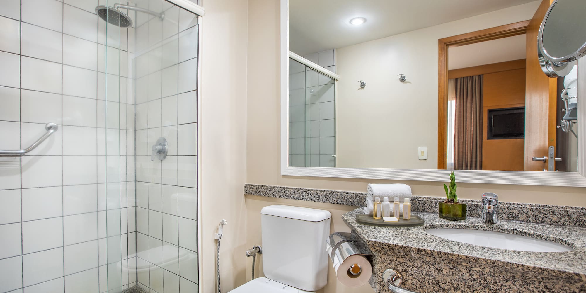 a bathroom with a sink and shower