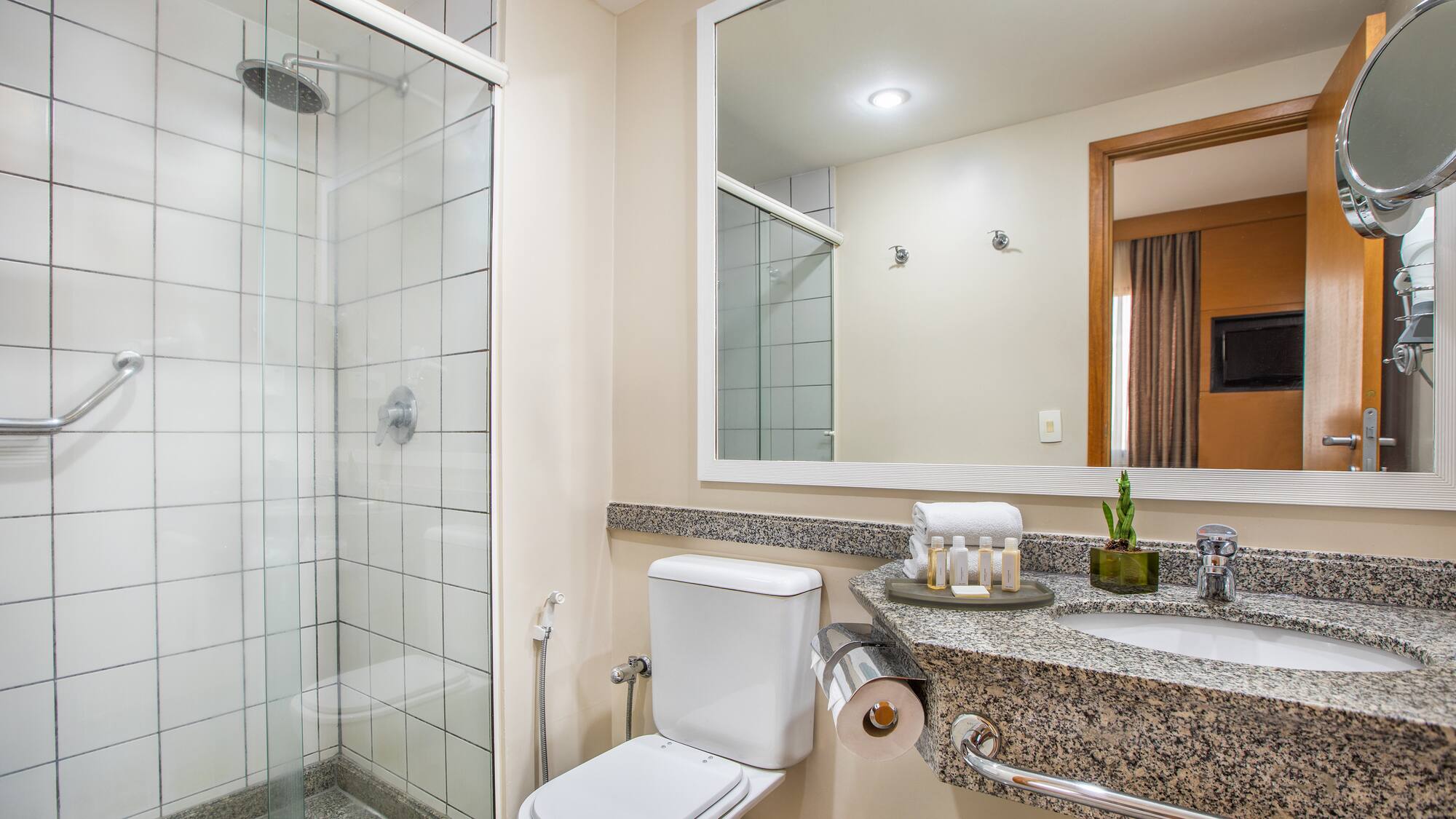 a bathroom with a sink and shower