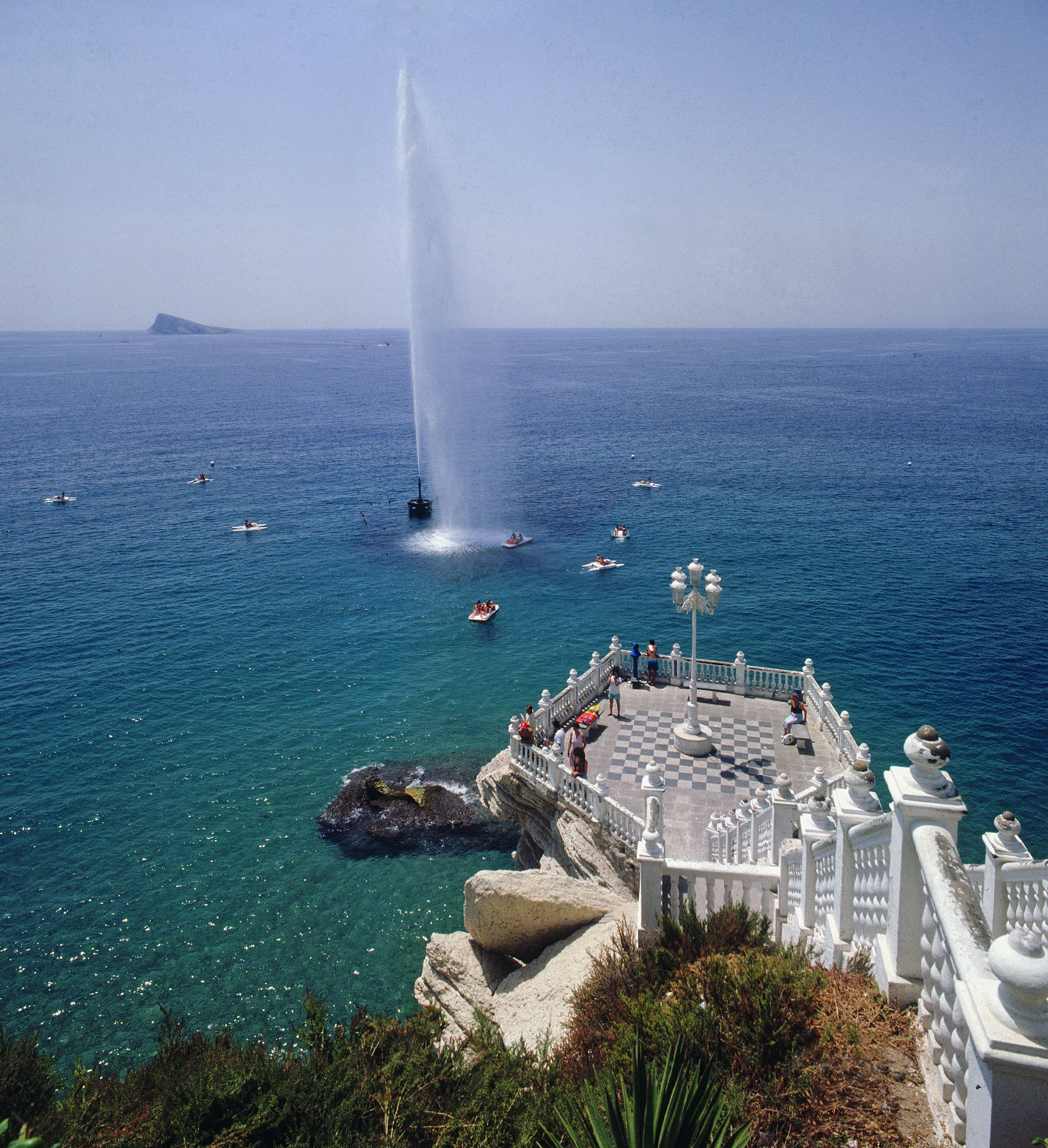 Benidorm viewpoint with sea fountain, pedal boats, and Benidorm Island.
