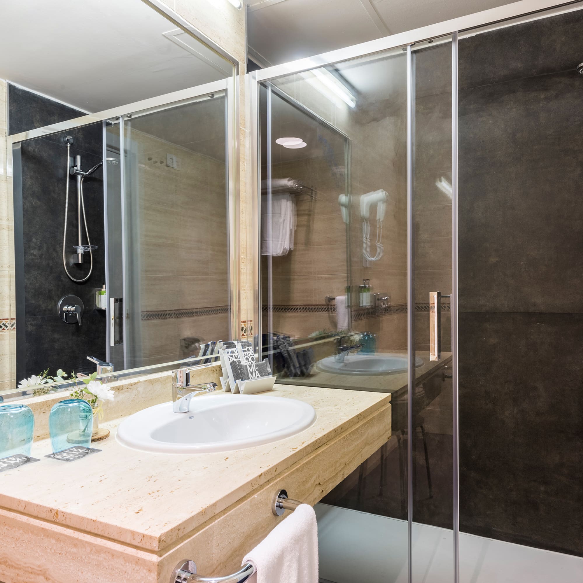 a bathroom with a shower and sink