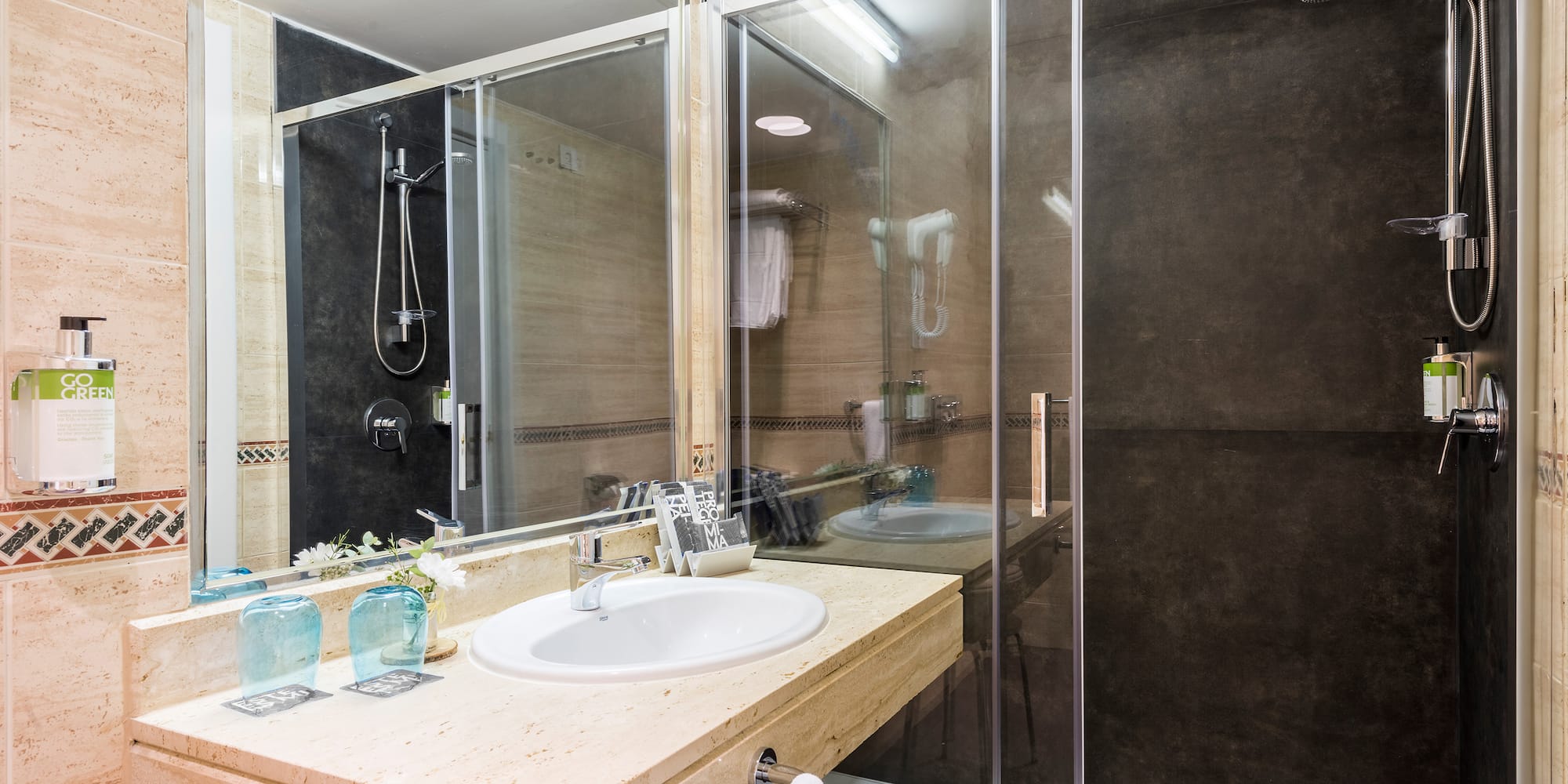 a bathroom with a shower and sink
