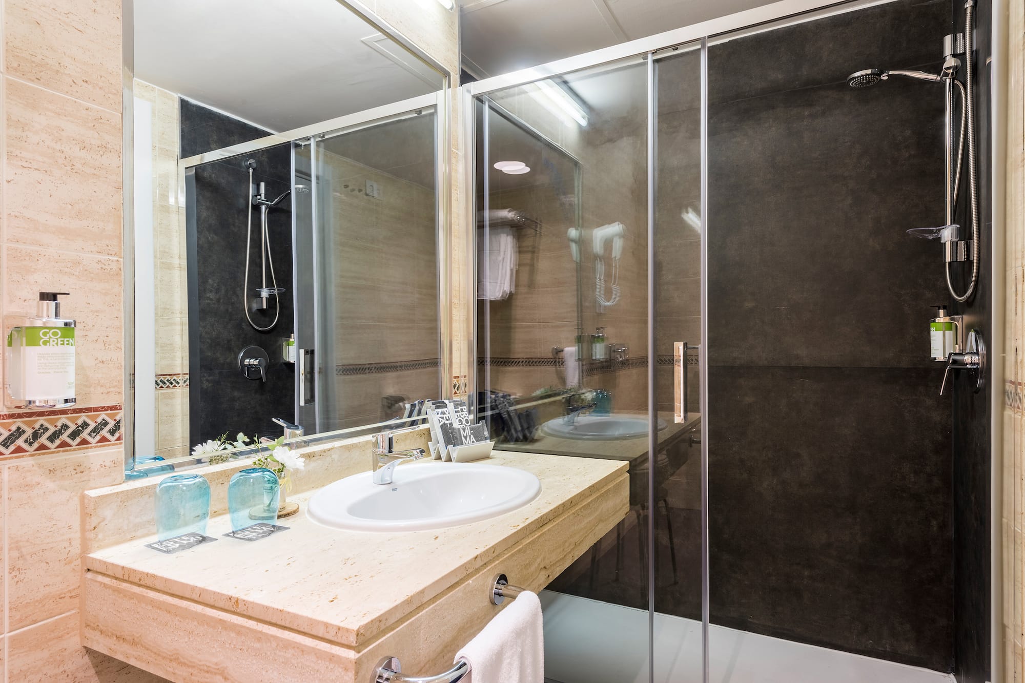 a bathroom with a shower and sink