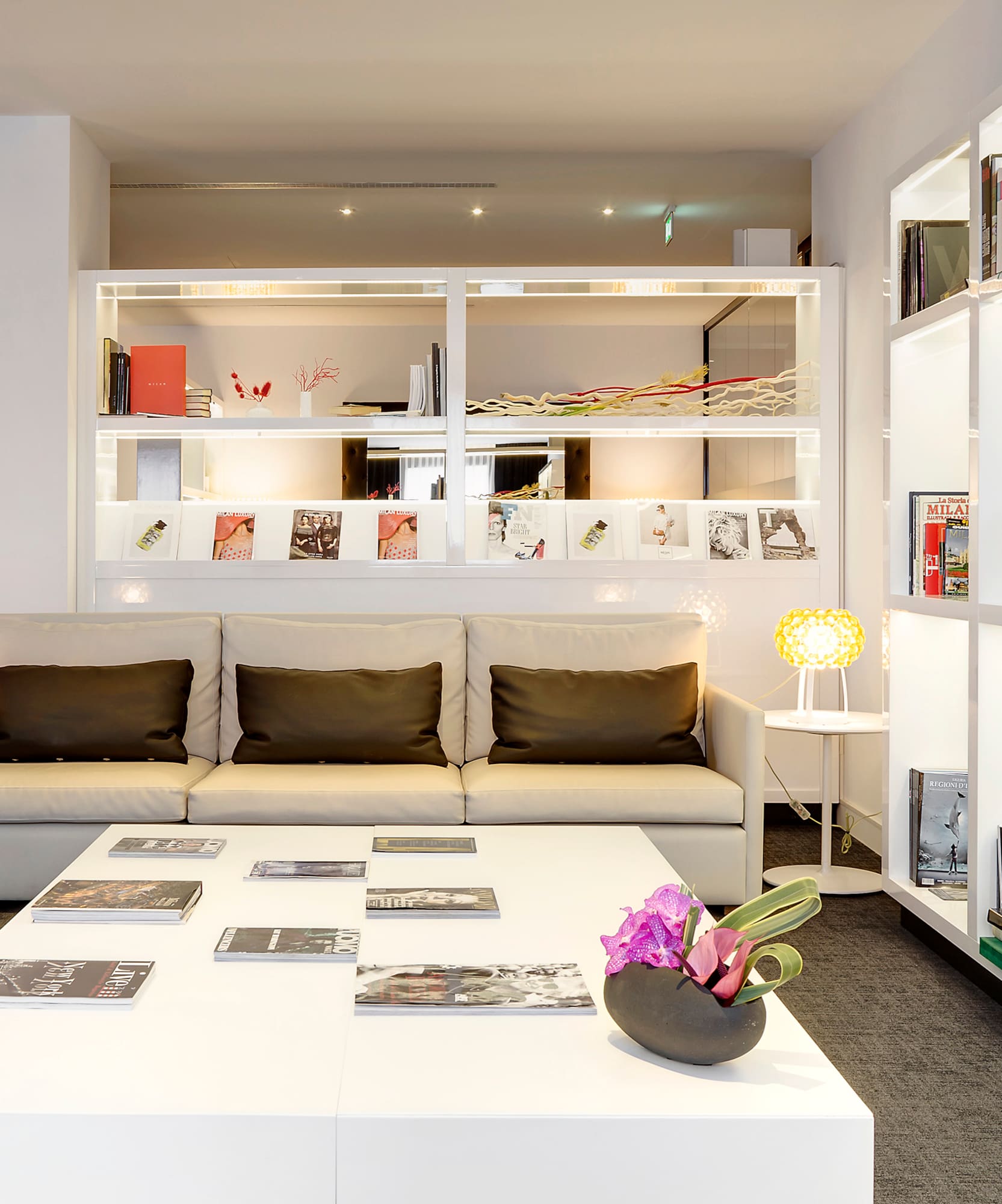 a room with a couch and a white table