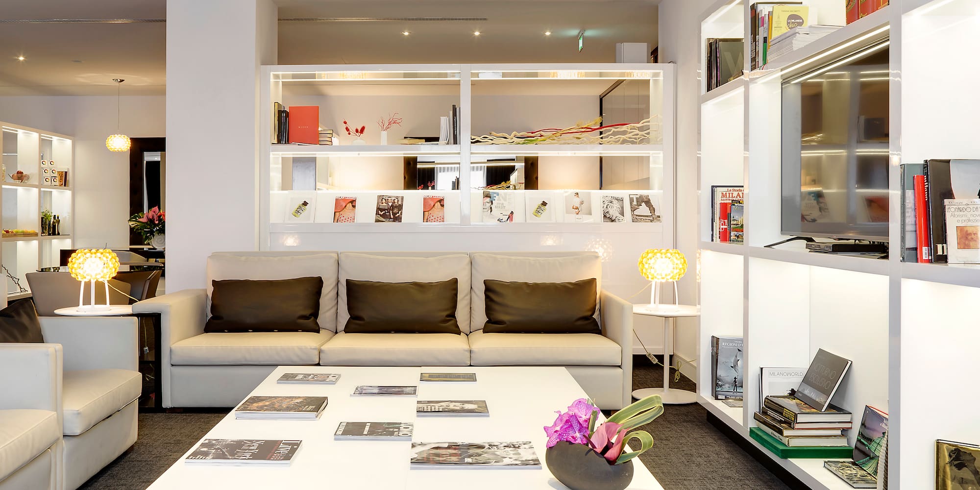 a room with a couch and a white table