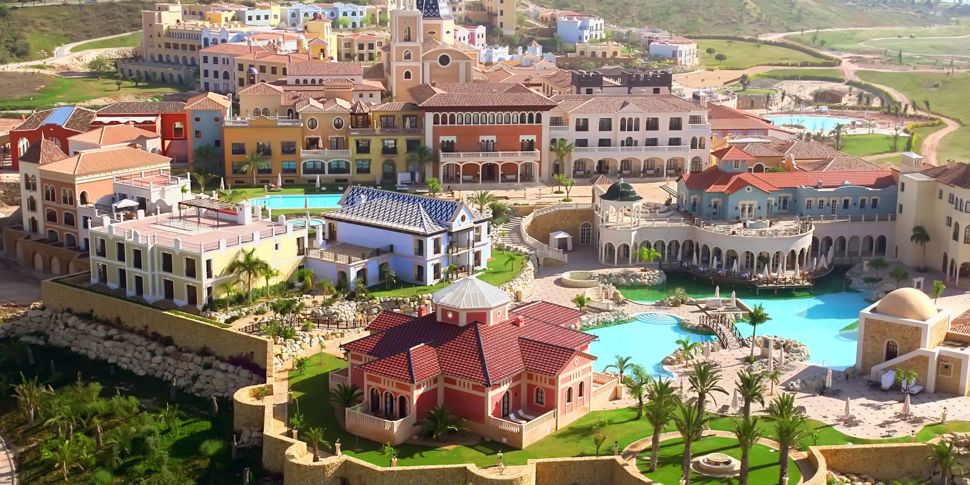 a large town with a pool and a building