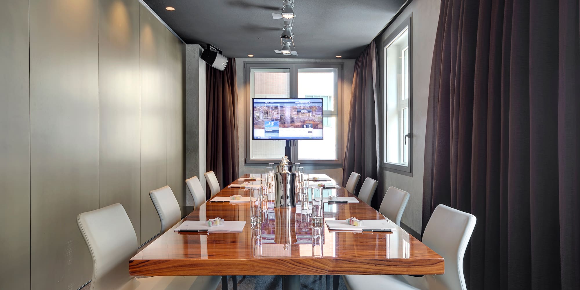 a conference room with a table and chairs