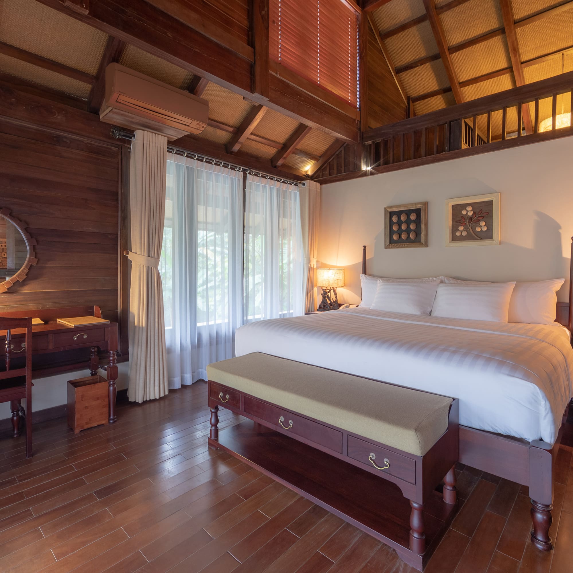 a bedroom with a wood floor and a wood floor