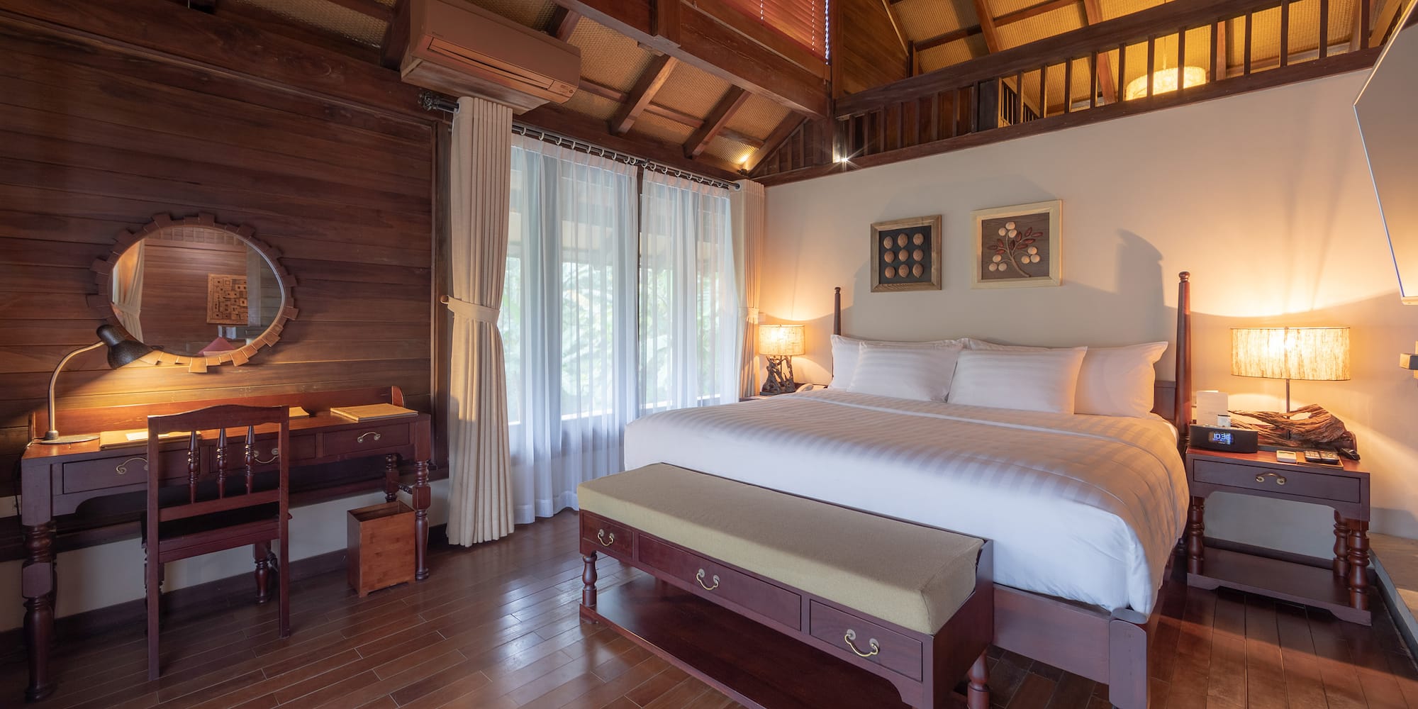 a bedroom with a wood floor and a wood floor