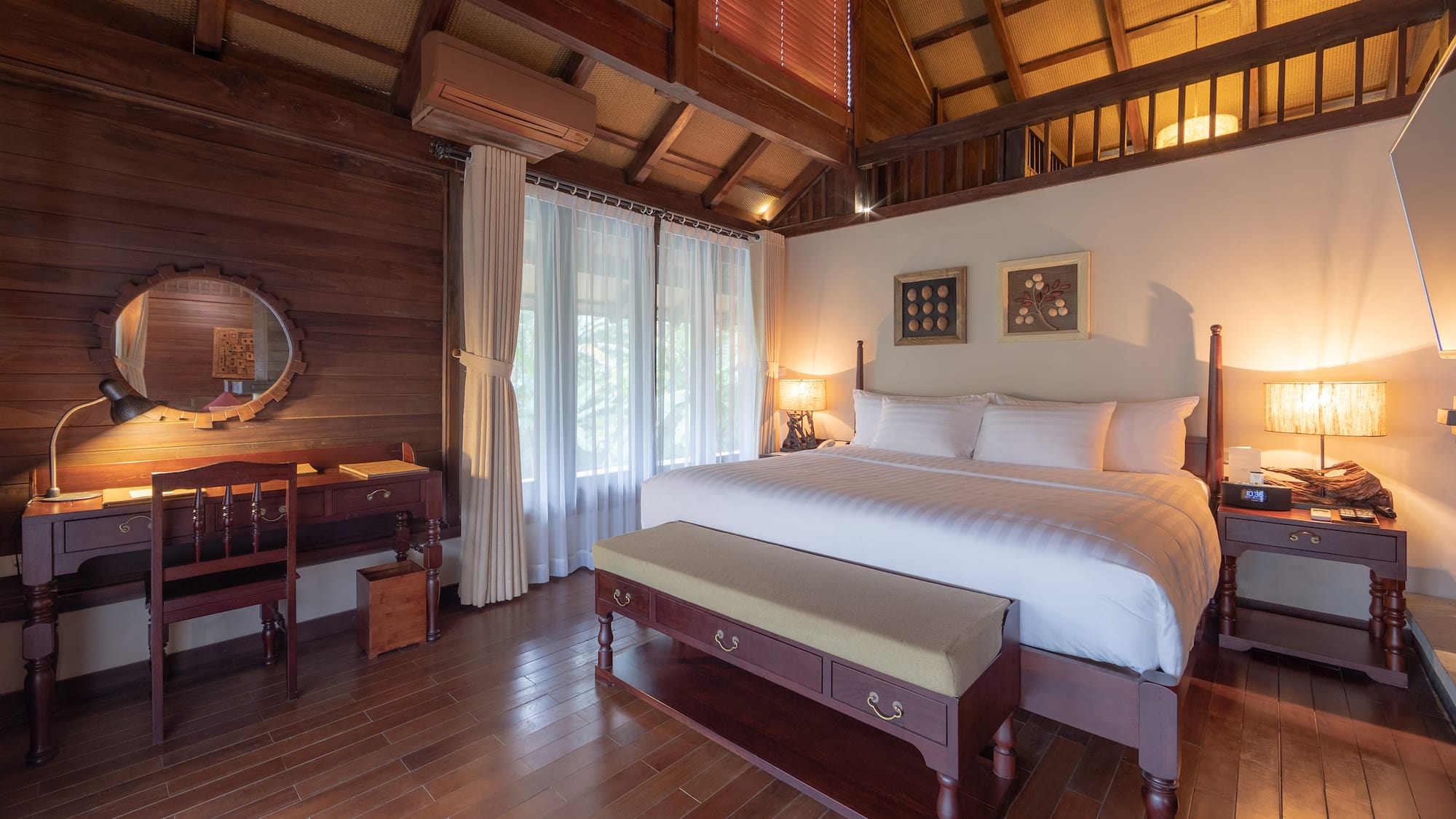 a bedroom with a wood floor and a wood floor