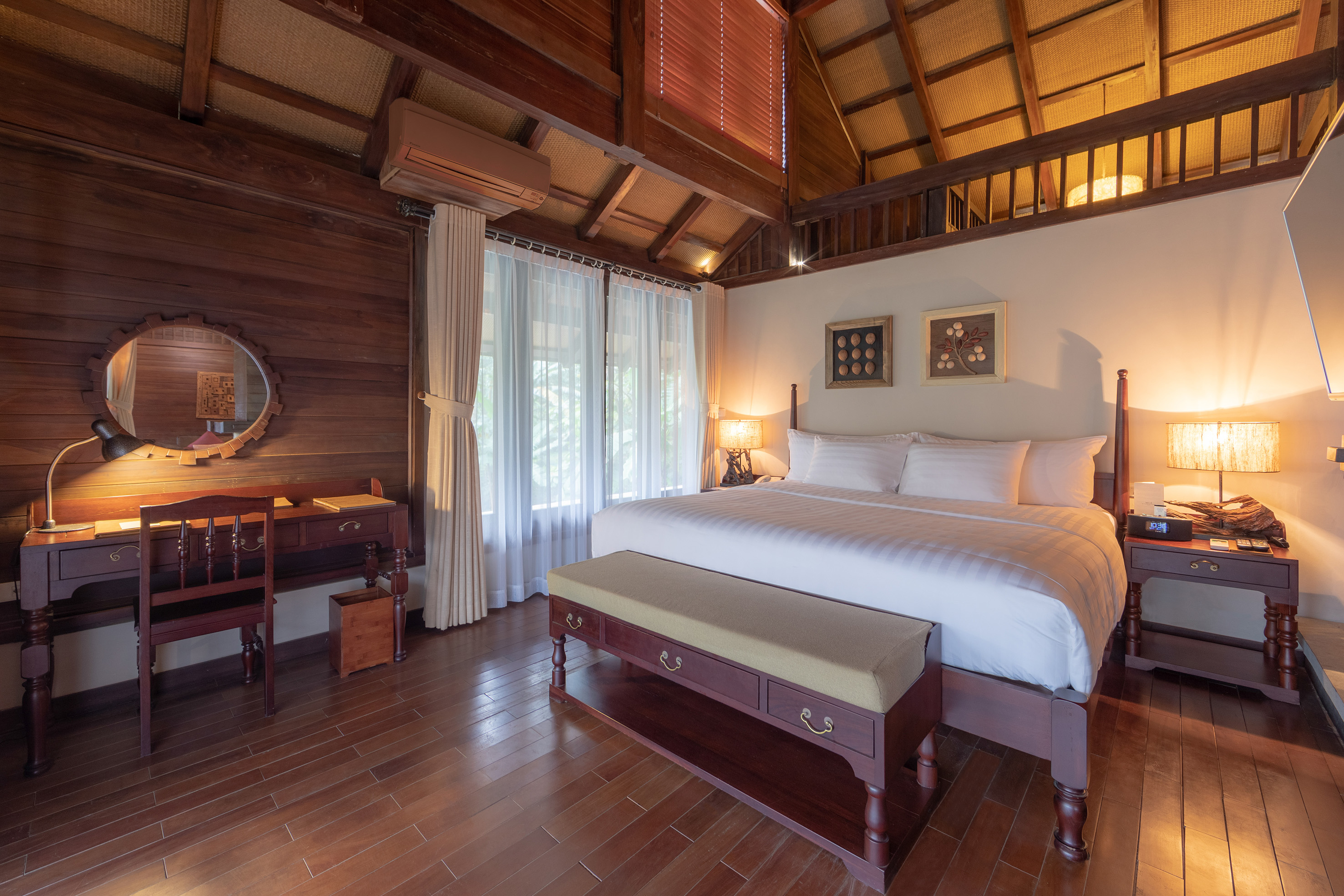 a bedroom with a wood floor and a wood floor