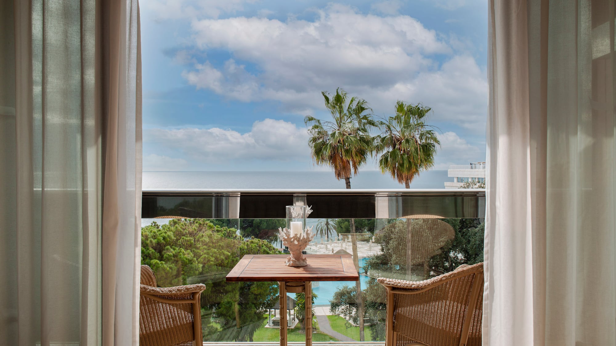 a table and chairs outside a window