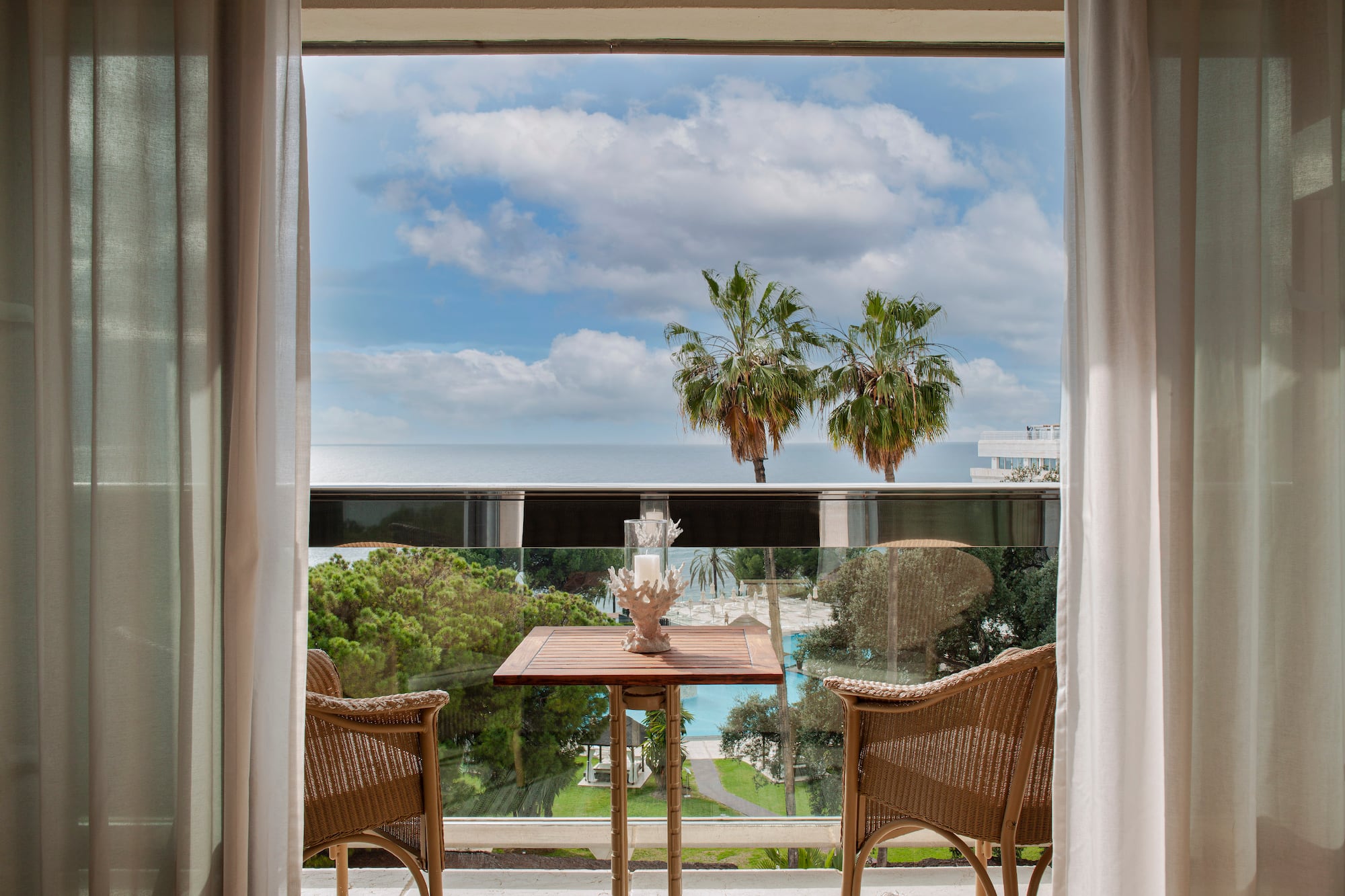 a table and chairs outside a window