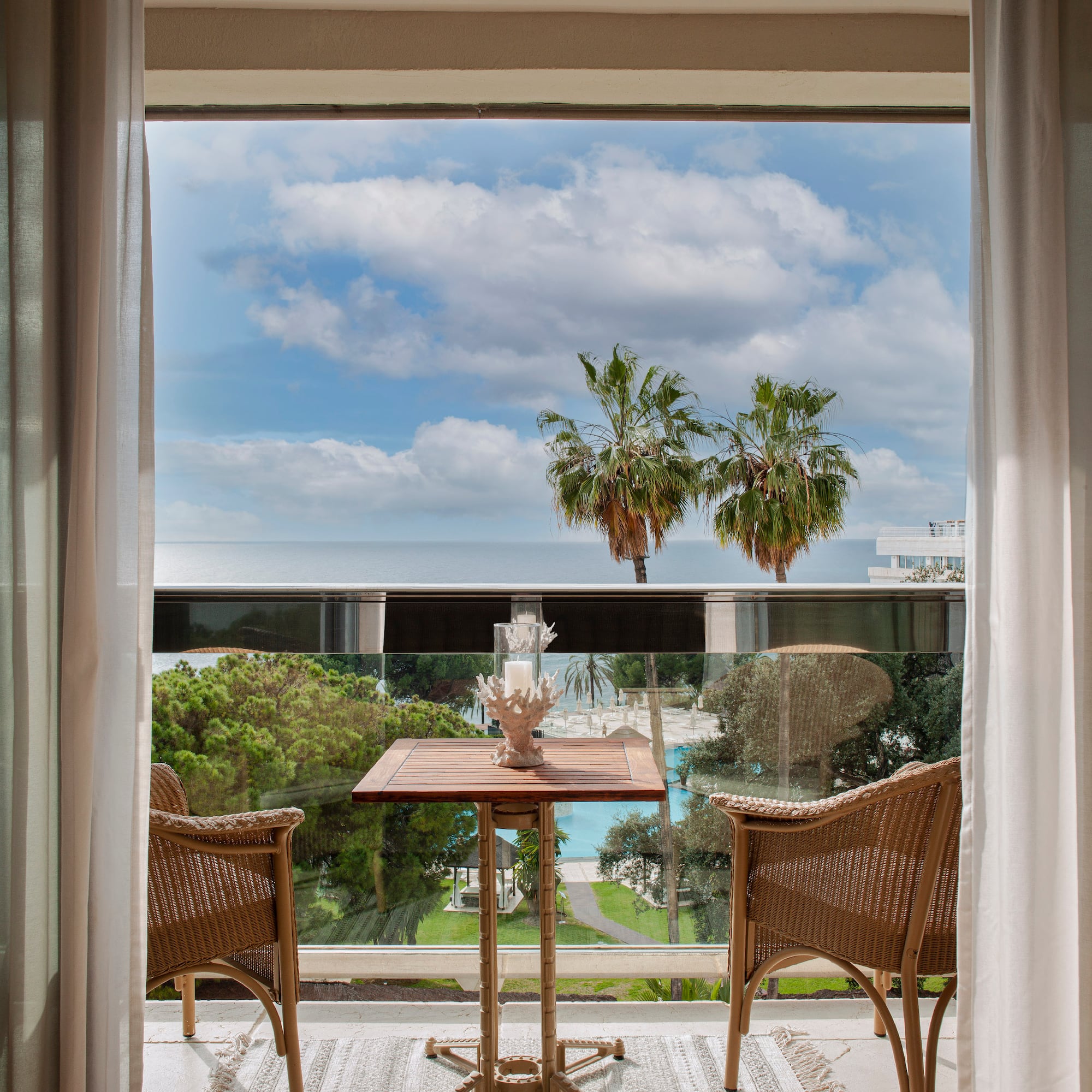 a table and chairs outside a window