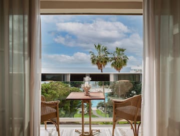 a table and chairs outside a window