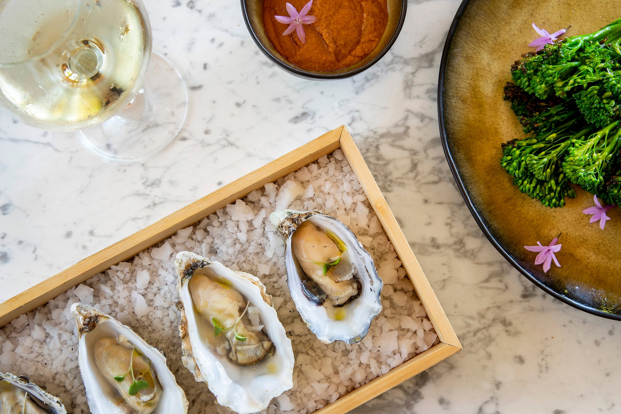 a plate of food and a glass of wine