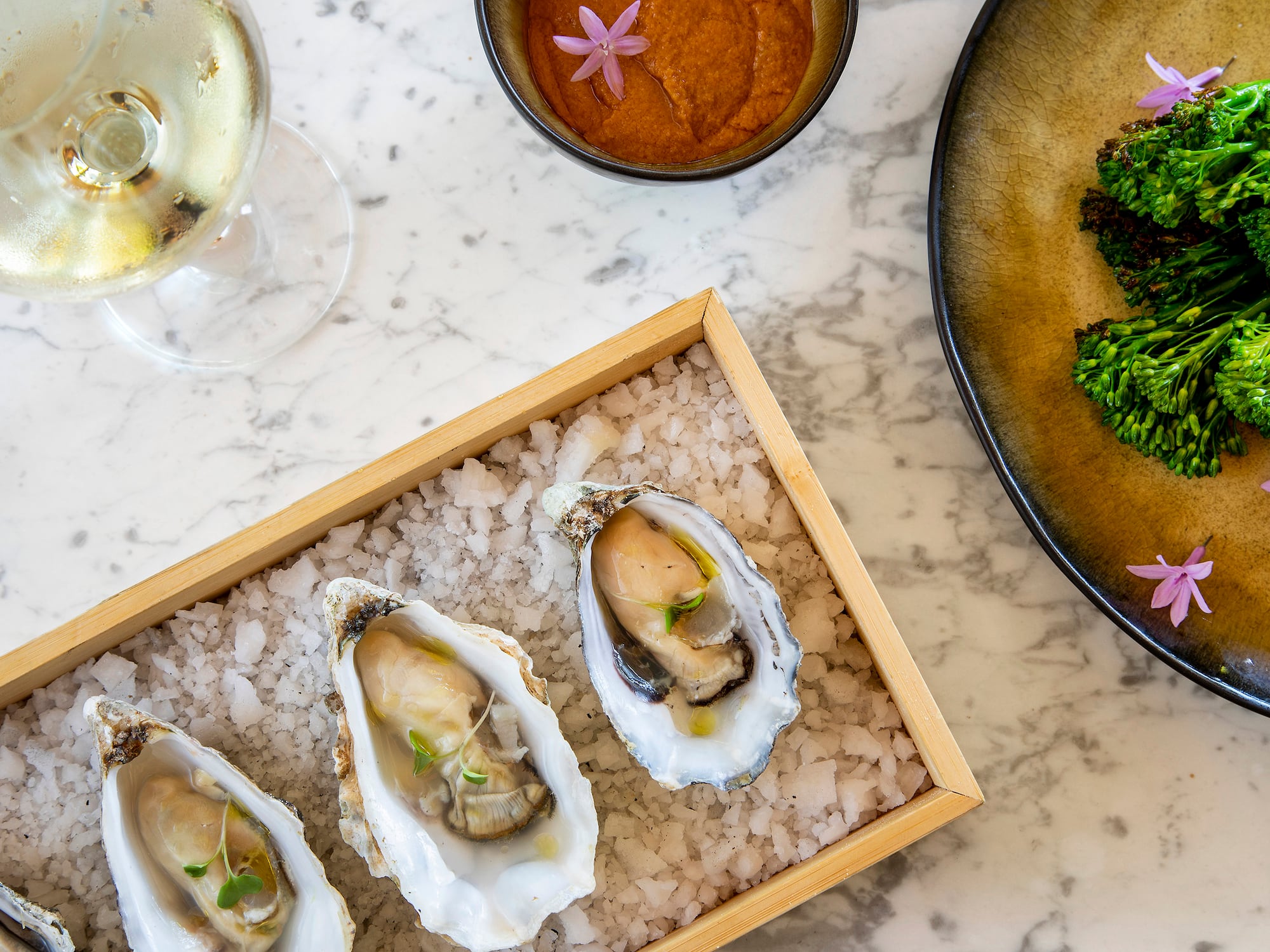 a plate of food and a glass of wine